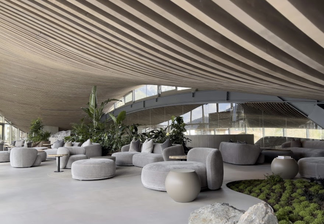 Hotel Krallerhof lounge with sculptural wood ceiling and modern furnishings