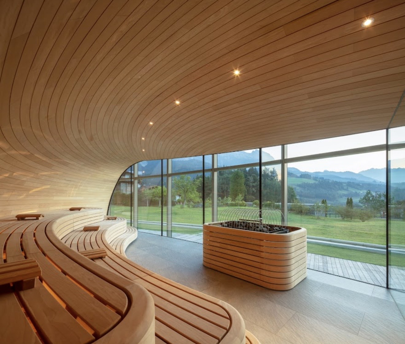 Hotel Krallerhof sauna interior with curved wood ceiling and mountain views